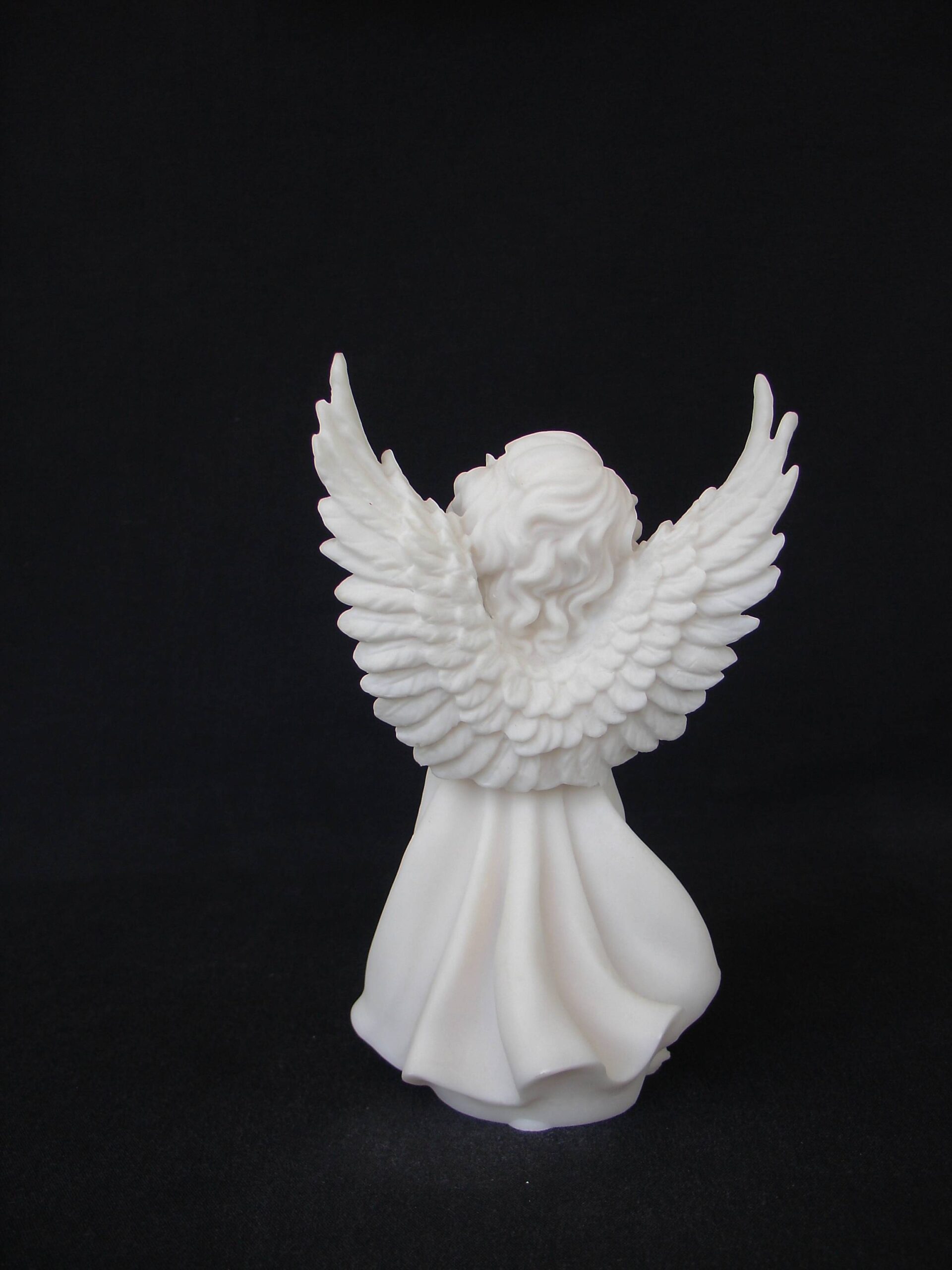 Angel holding a pigeon statue — image 3