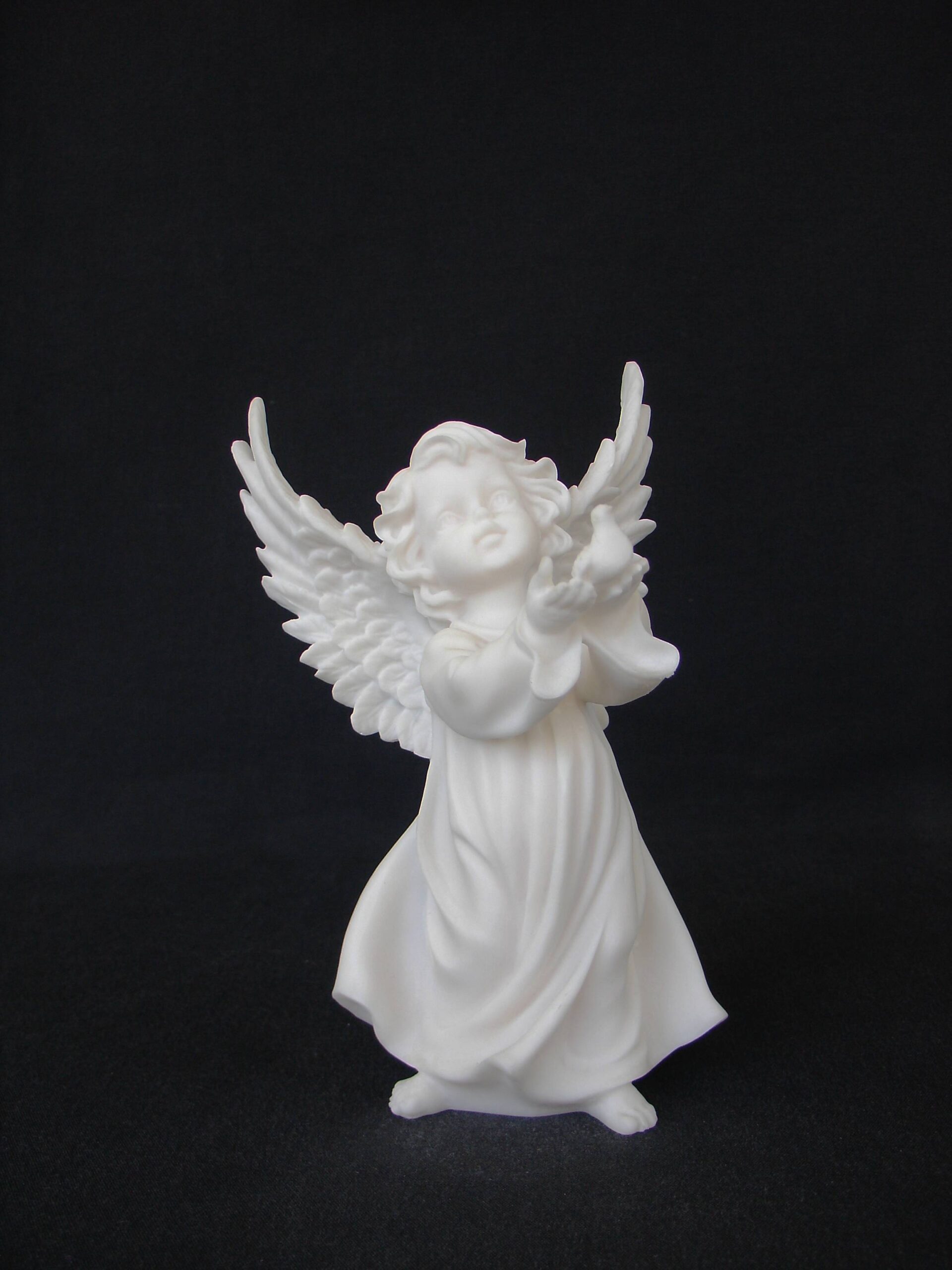 Angel holding a pigeon statue — image 2
