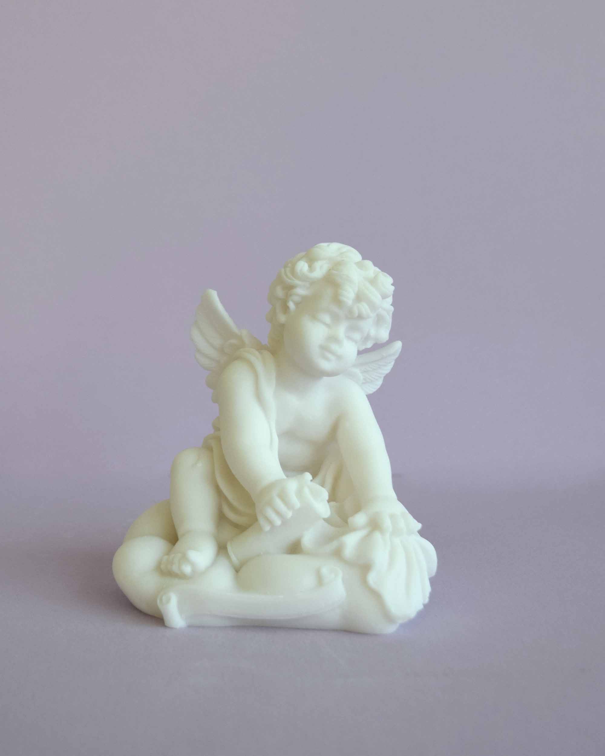 Angel holding papyrus statue — image 2