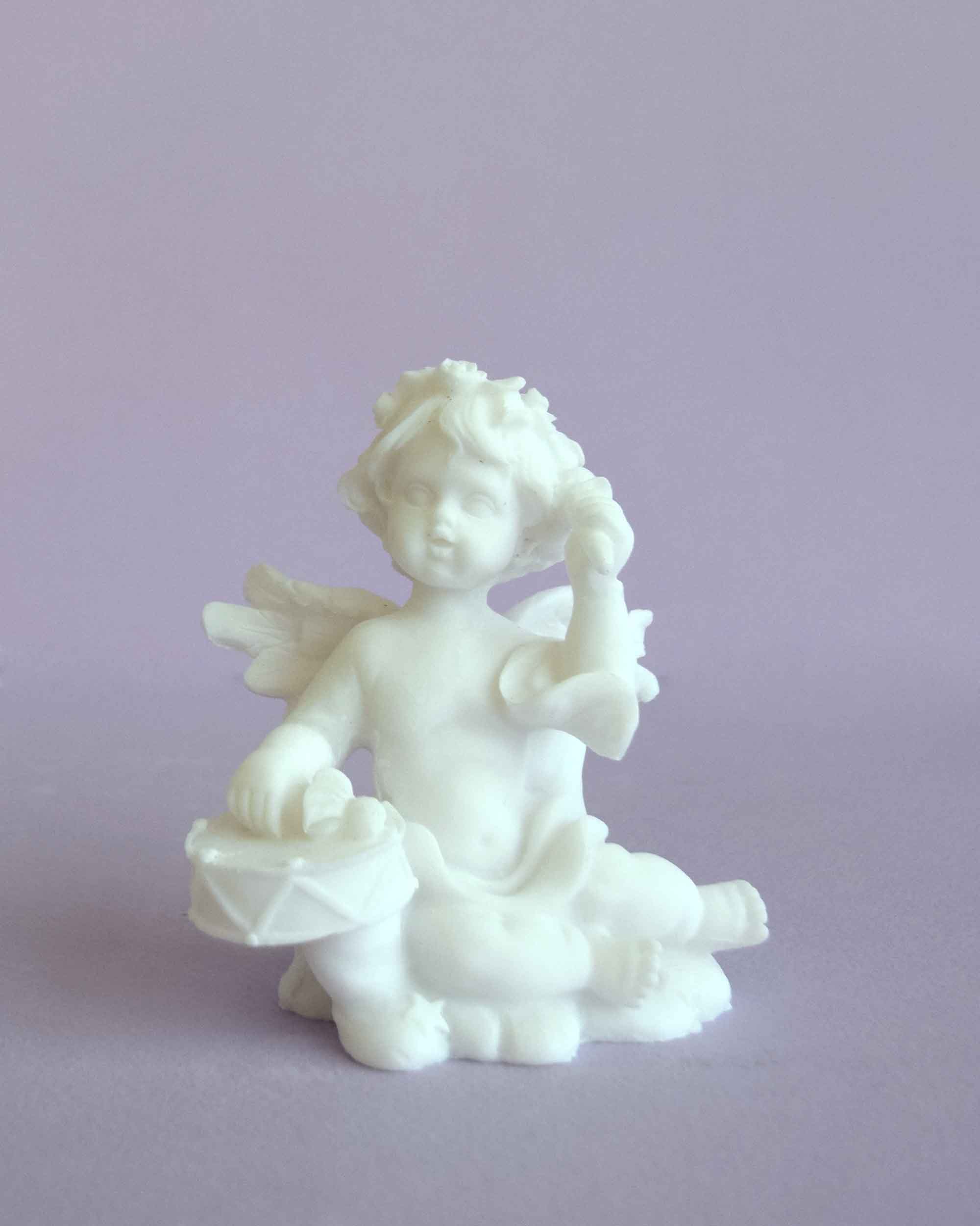 Angel playing drums statue — image 4