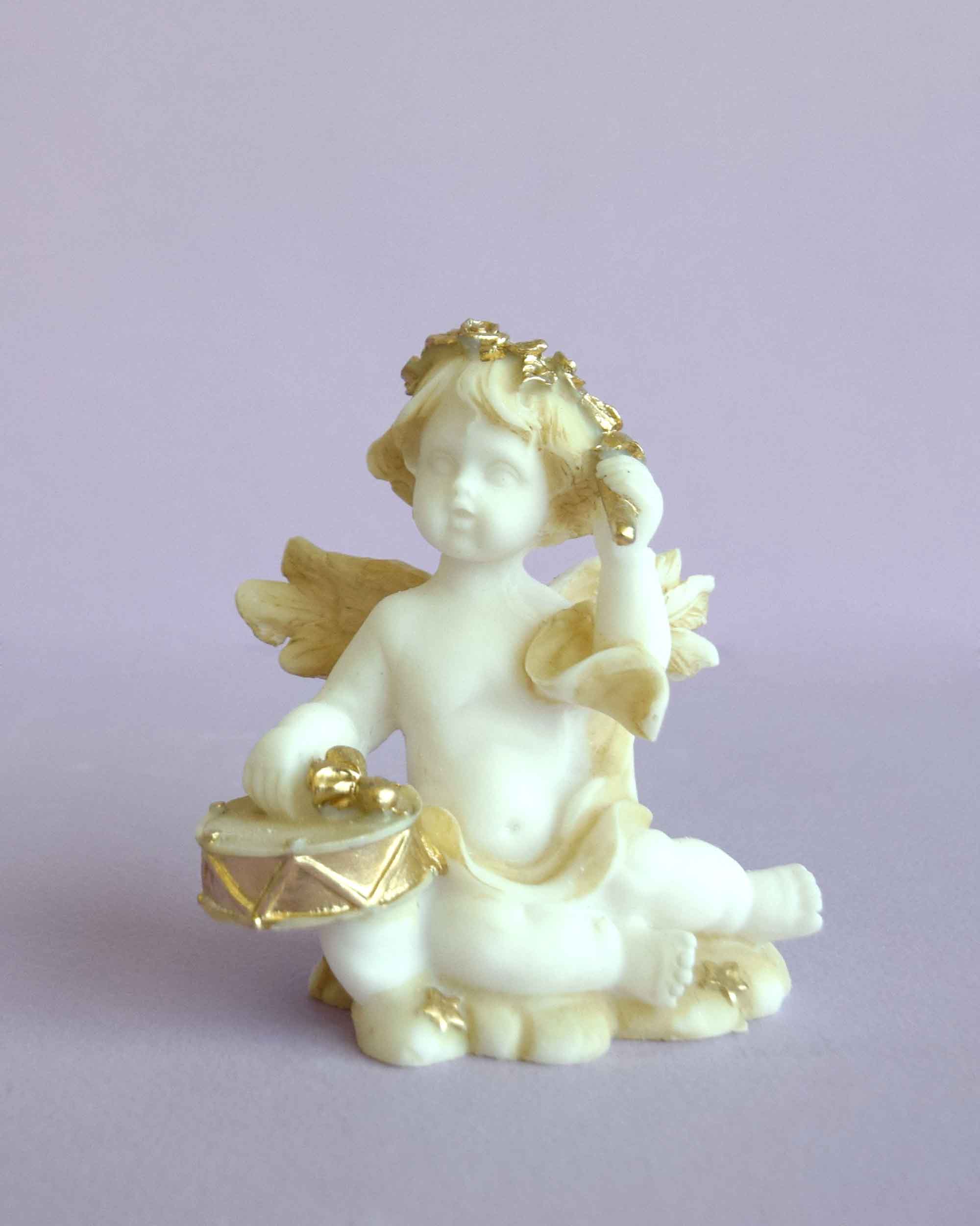 Angel playing drums statue — image 3