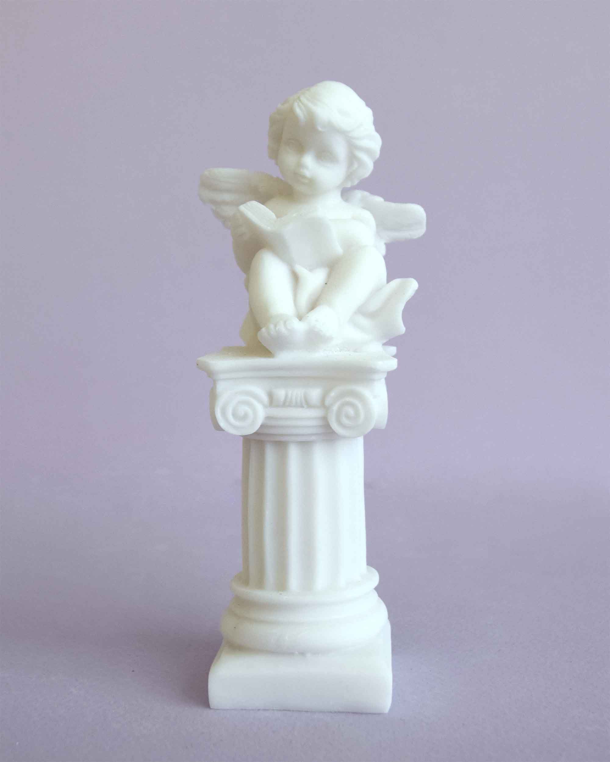 Angel sitting on a column statue — image 2