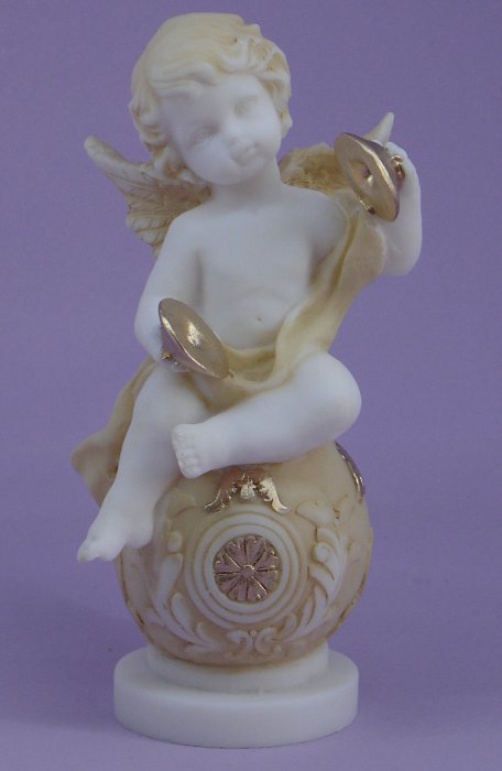 Angel playing cymbals statue
