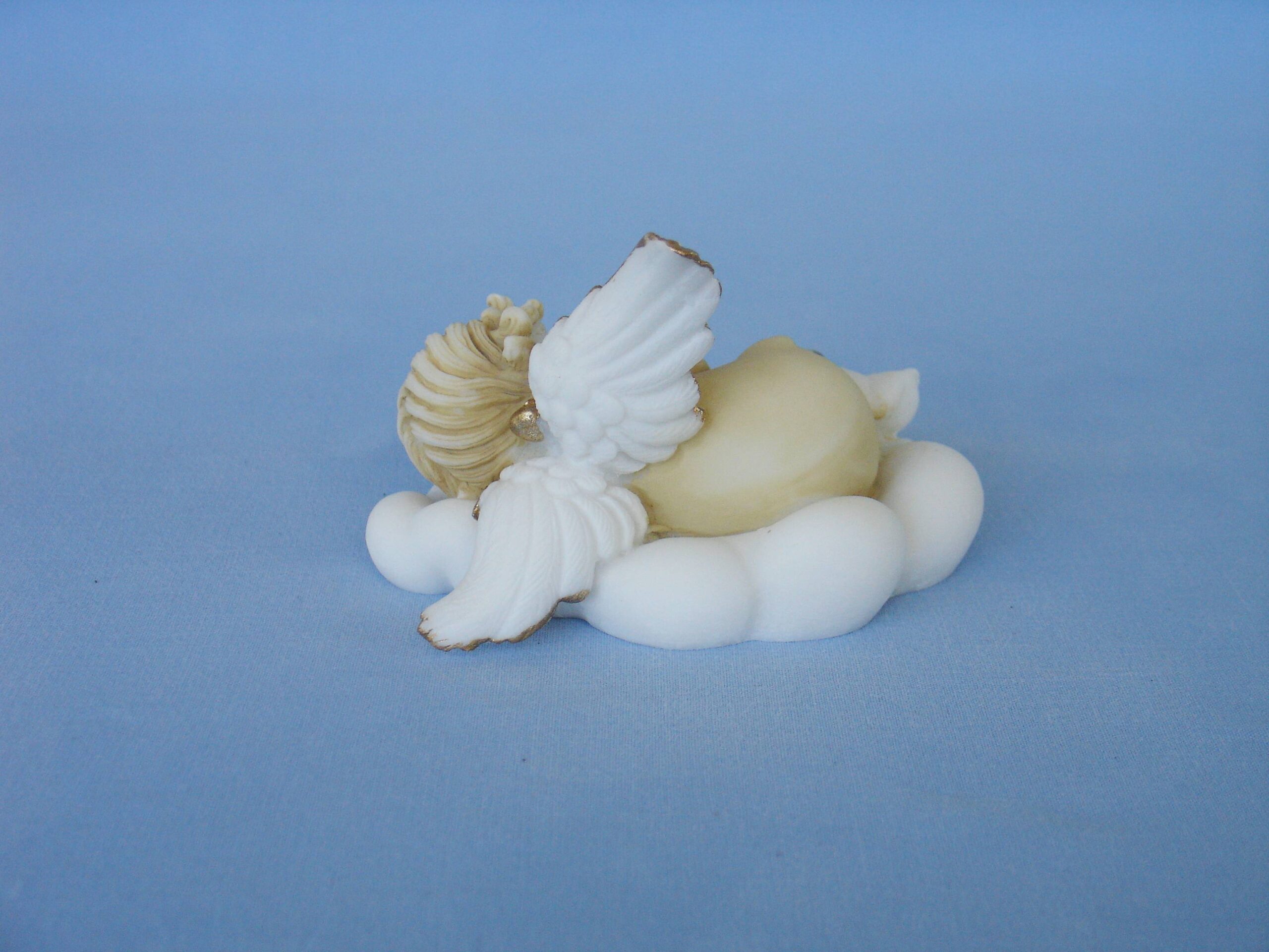 Angel sleeps on a cloud statue — image 3