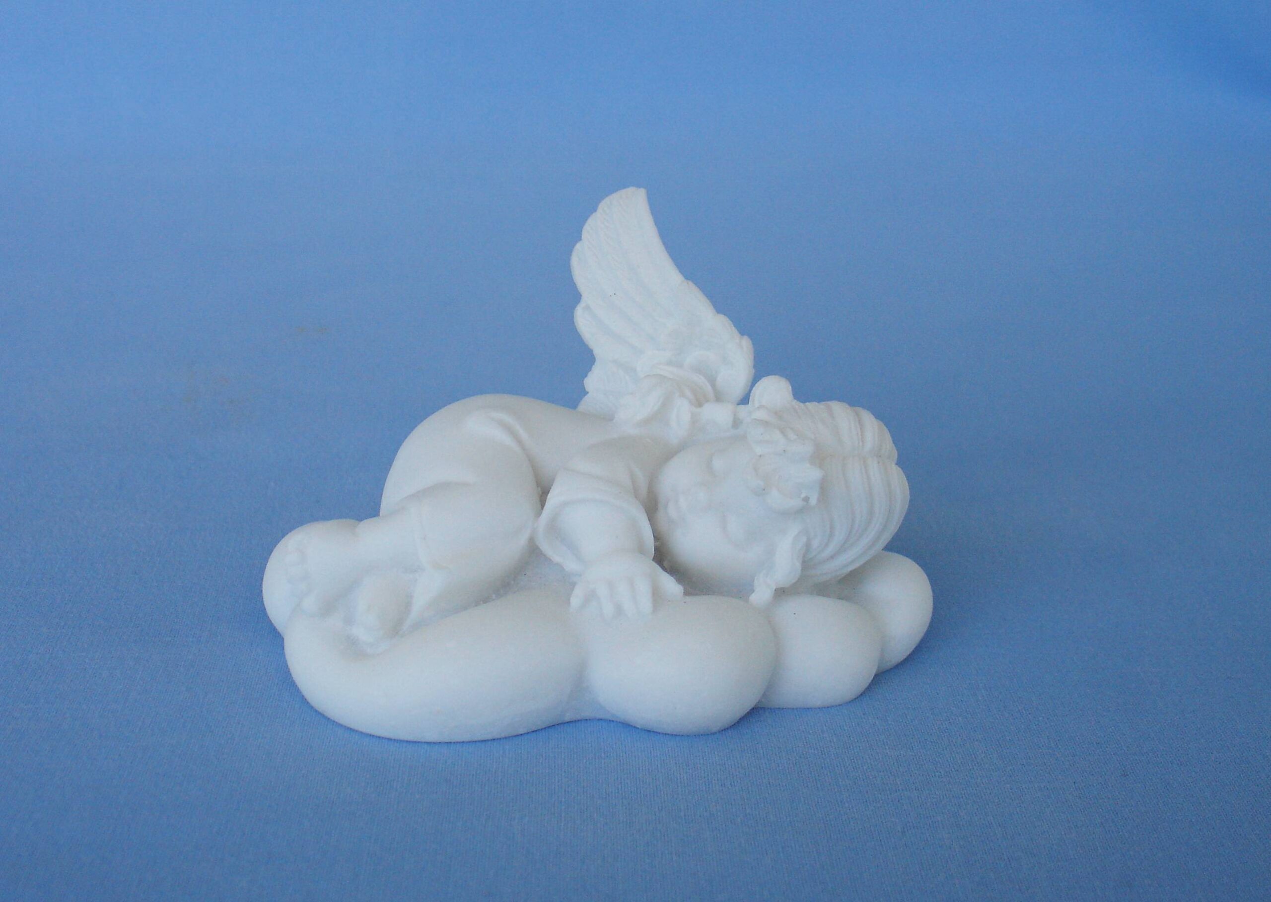 Angel sleeps on a cloud statue — image 2