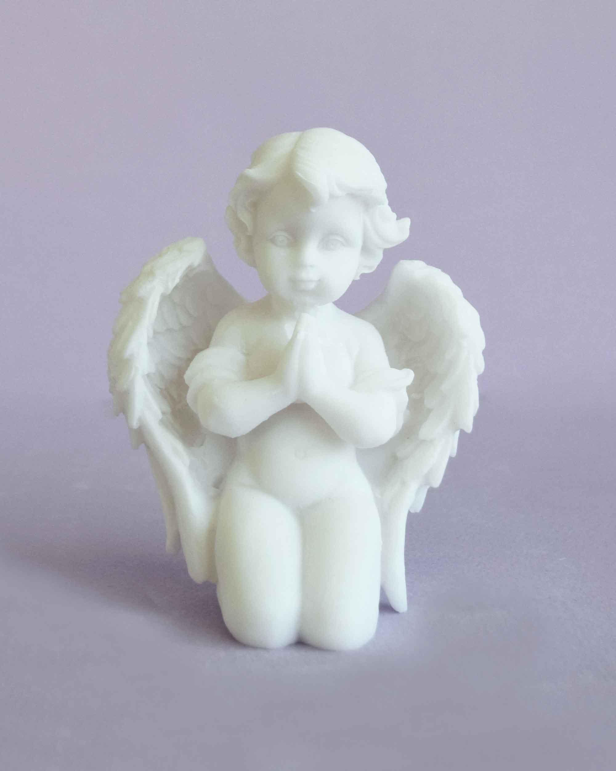 Angel statue praying on its knees — image 2