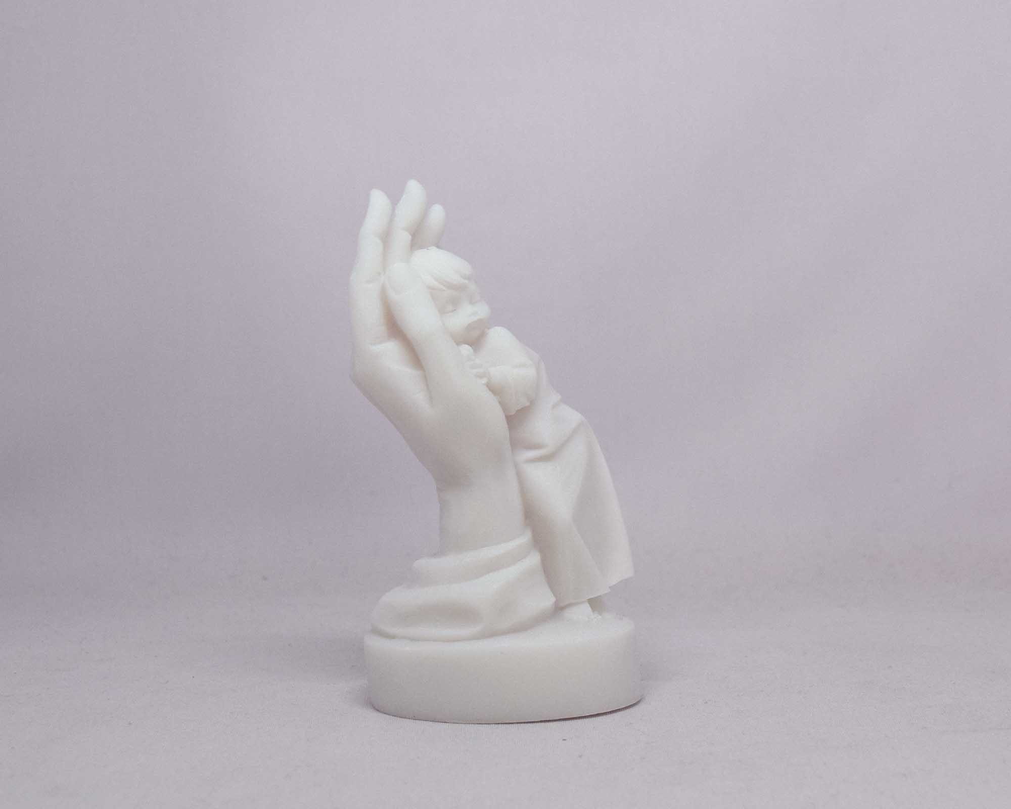 Boy in hand statue — image 2