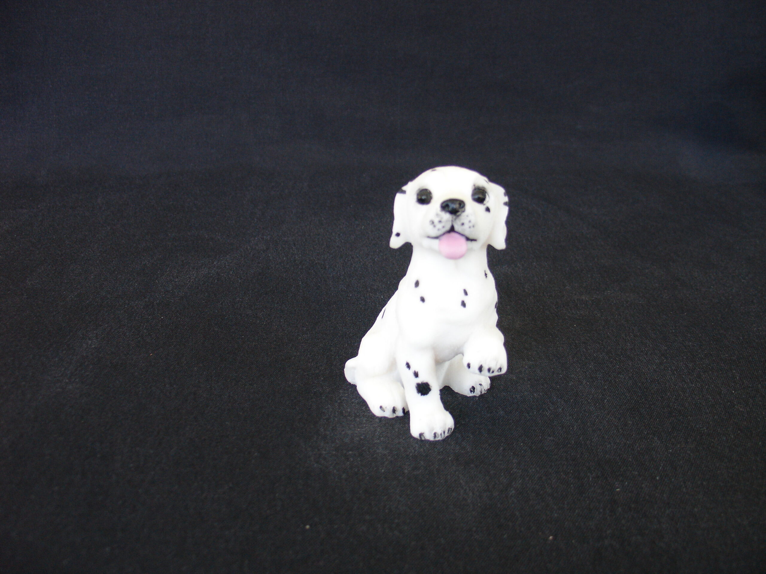 Dalmatian baby pet dog statue sitting on the floor