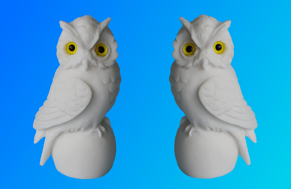 Owl sitting on a sphere statue — image 6