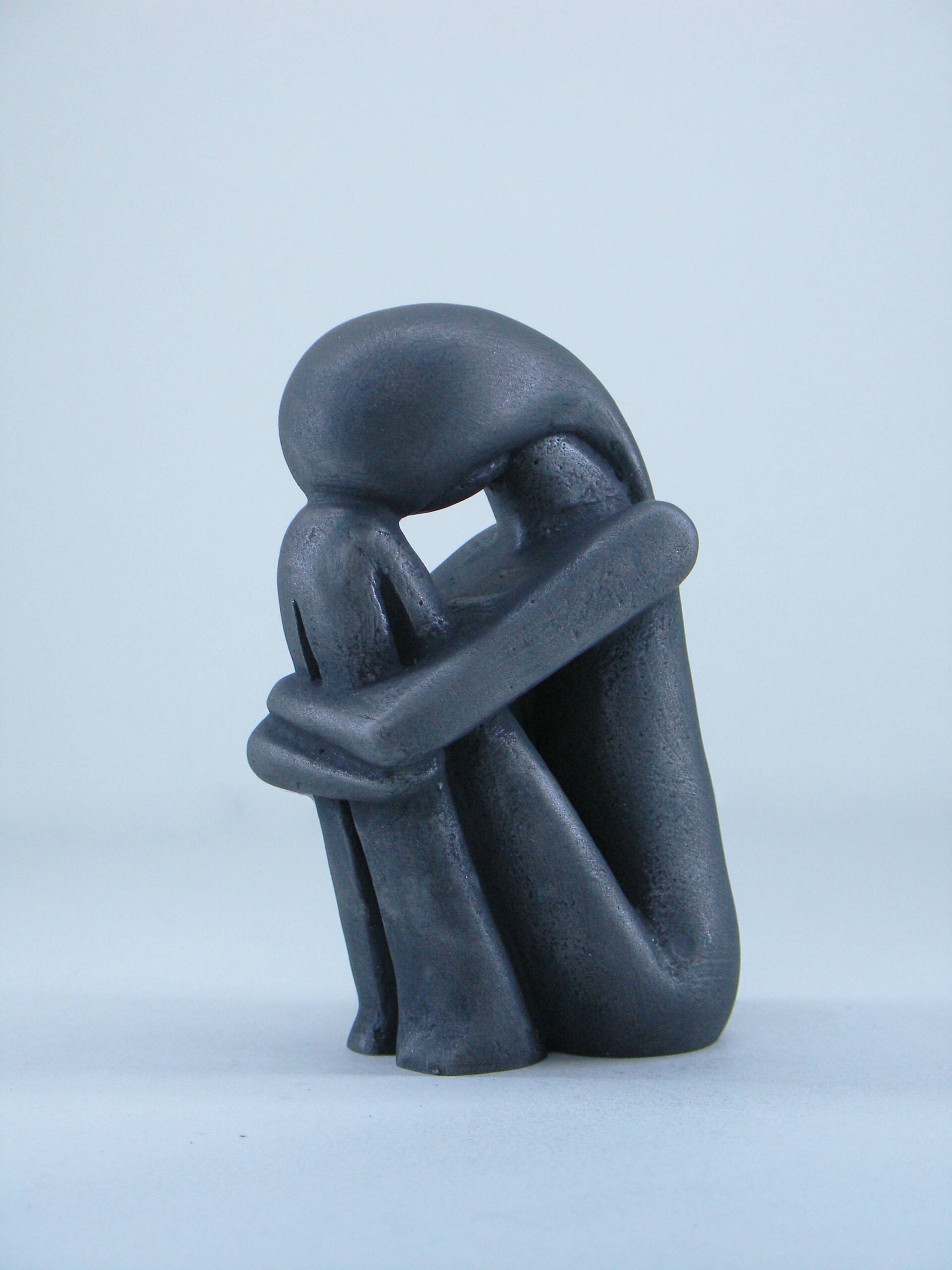 Woman hugging her feet in Cycladic art — image 2